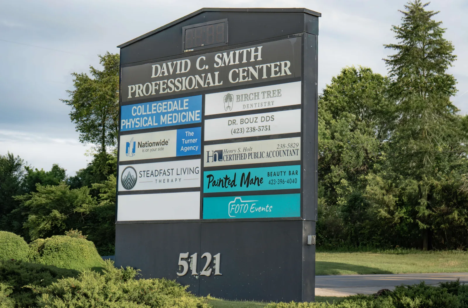 The David C. Smith Professional Center street sign listing Birch Tree Dentistry and Dr. Bouz DDS