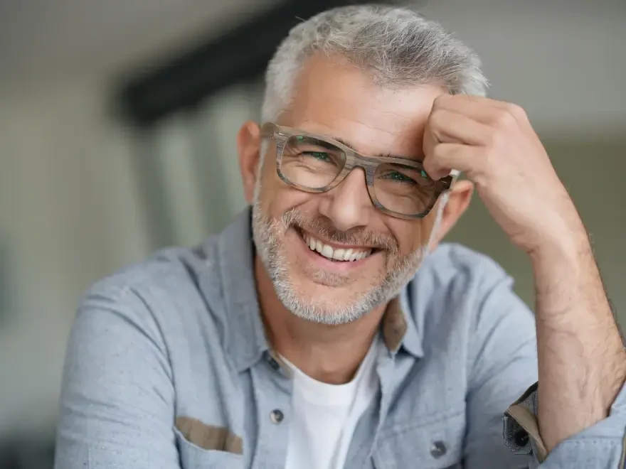 A patient smiling during a relaxed conversation