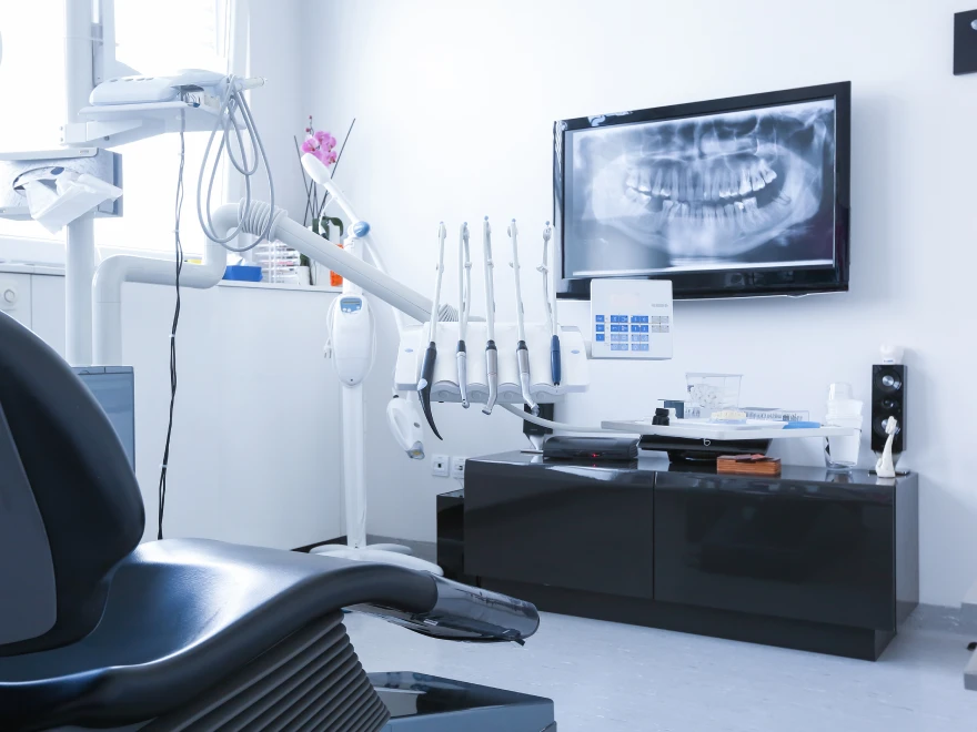 A full dental X-ray displayed on a monitor in the treatment room
